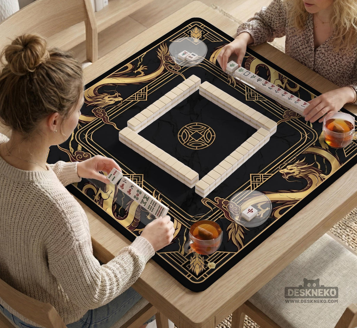Square black mahjong mat with gold dragon artwork around the border and a light marble texture in the center.