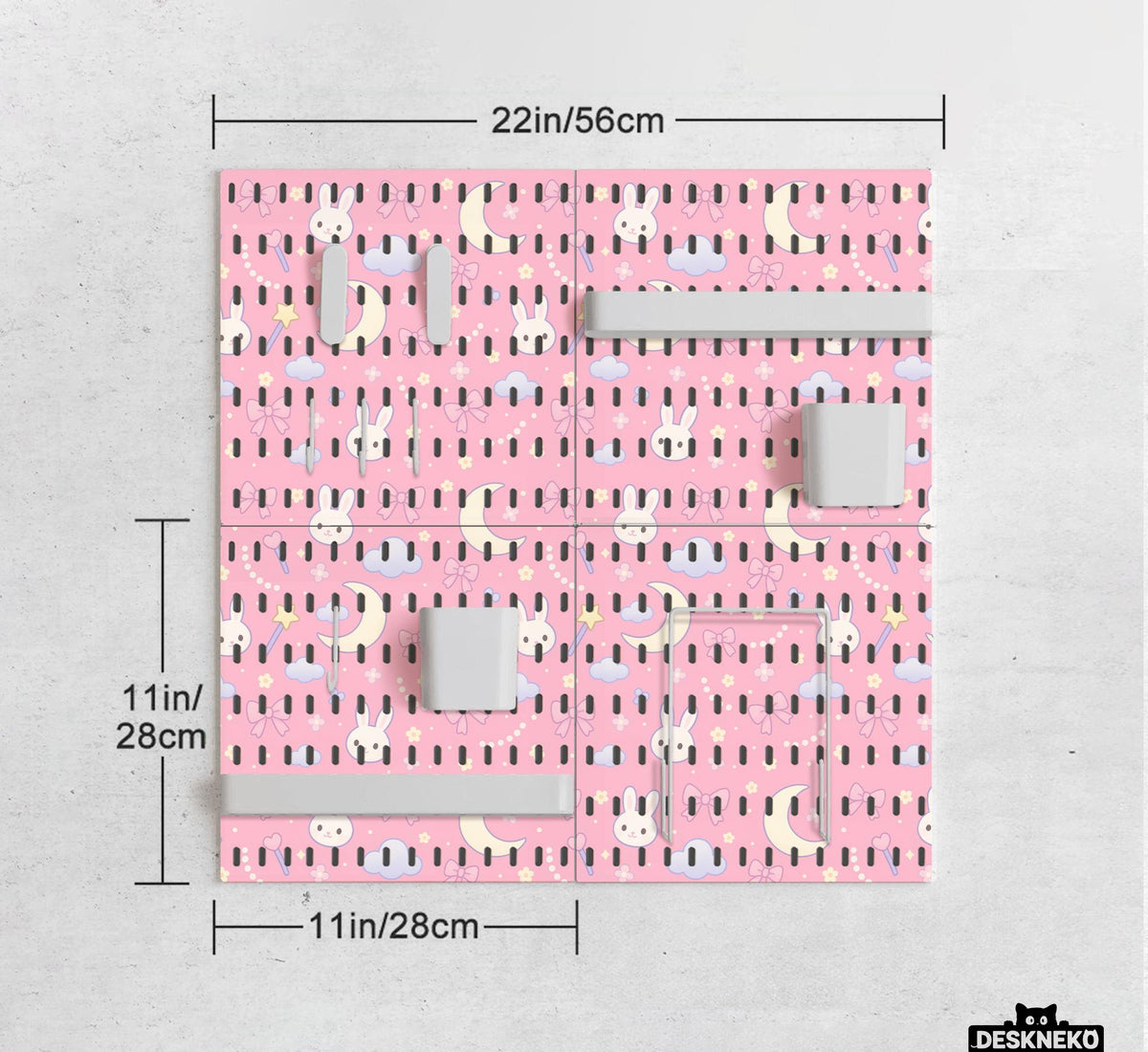 Pink pegboard panels with a kawaii bunny, cloud, moon, bow, and star pattern shown as a wall organizer set.