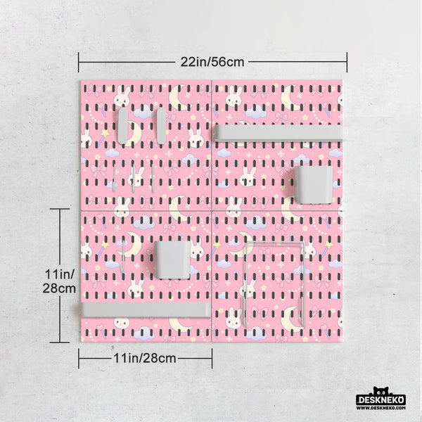 Pink pegboard panels with a kawaii bunny, cloud, moon, bow, and star pattern shown as a wall organizer set.
