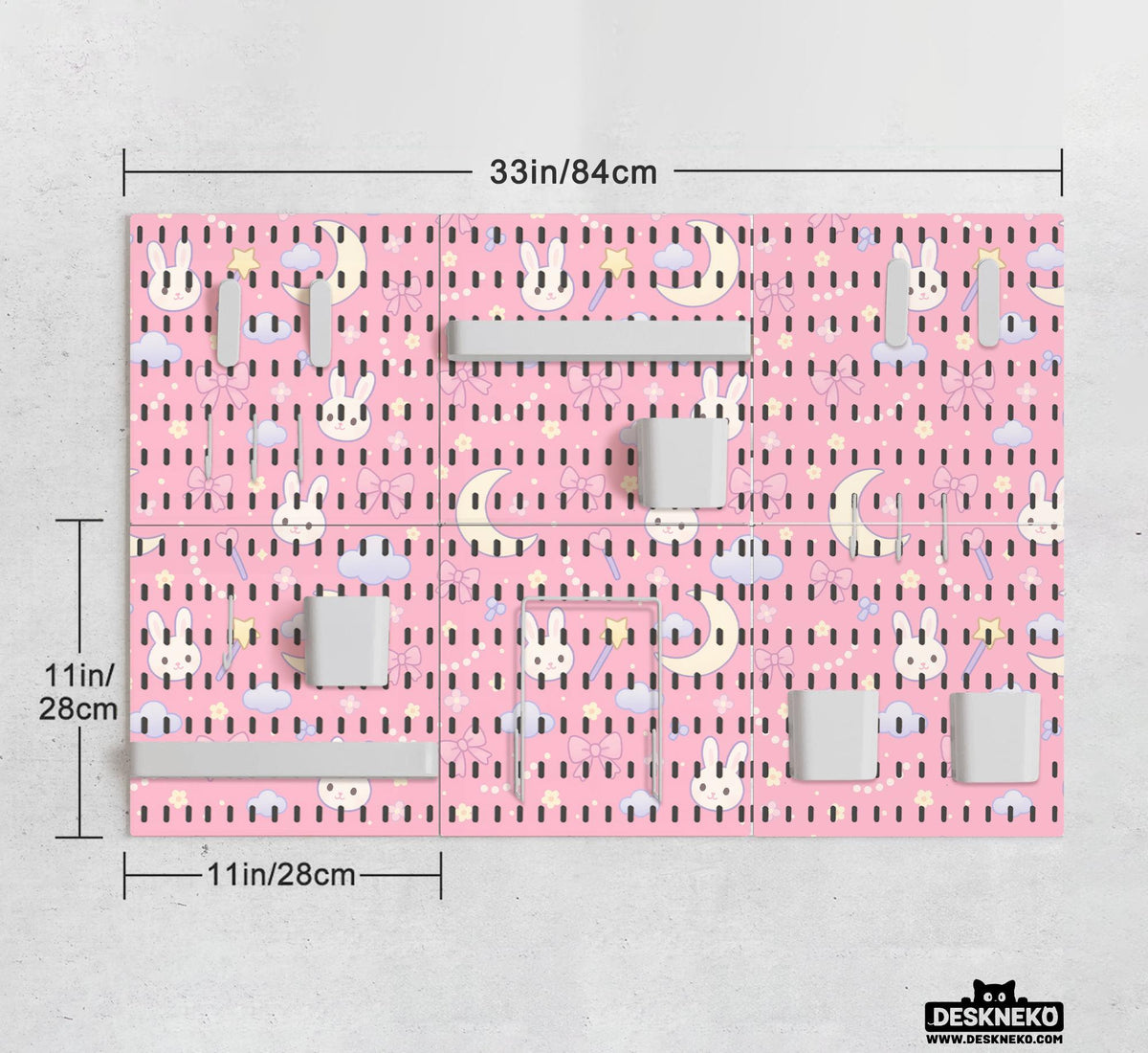 Pink pegboard panels with a kawaii bunny, cloud, moon, bow, and star pattern shown as a wall organizer set.