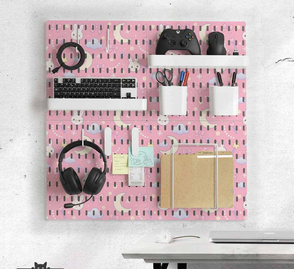 Pink pegboard panels with a kawaii bunny, cloud, moon, bow, and star pattern shown as a wall organizer set.