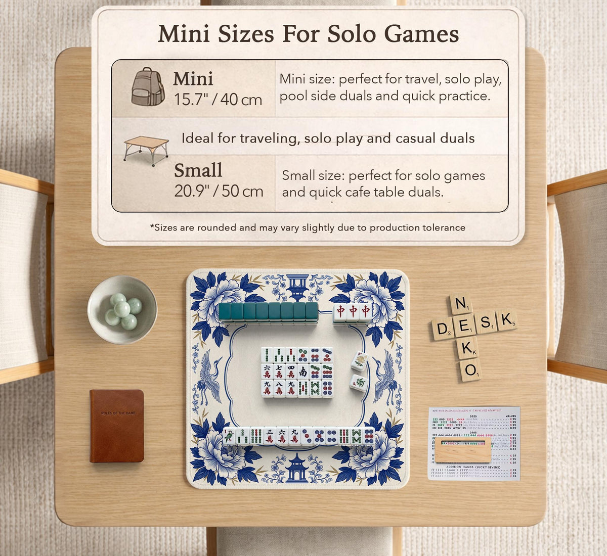 Blue and white mahjong mat with cranes, floral porcelain-style artwork, a cream center area, and a decorative border.