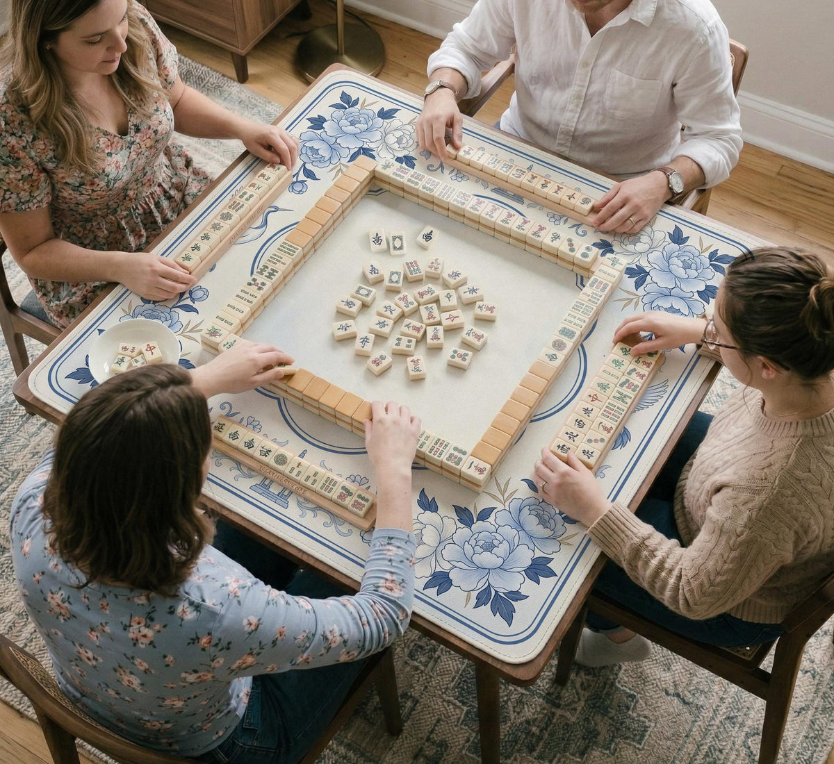 Square mahjong mat with a blue chinoiserie floral pattern on a light background.