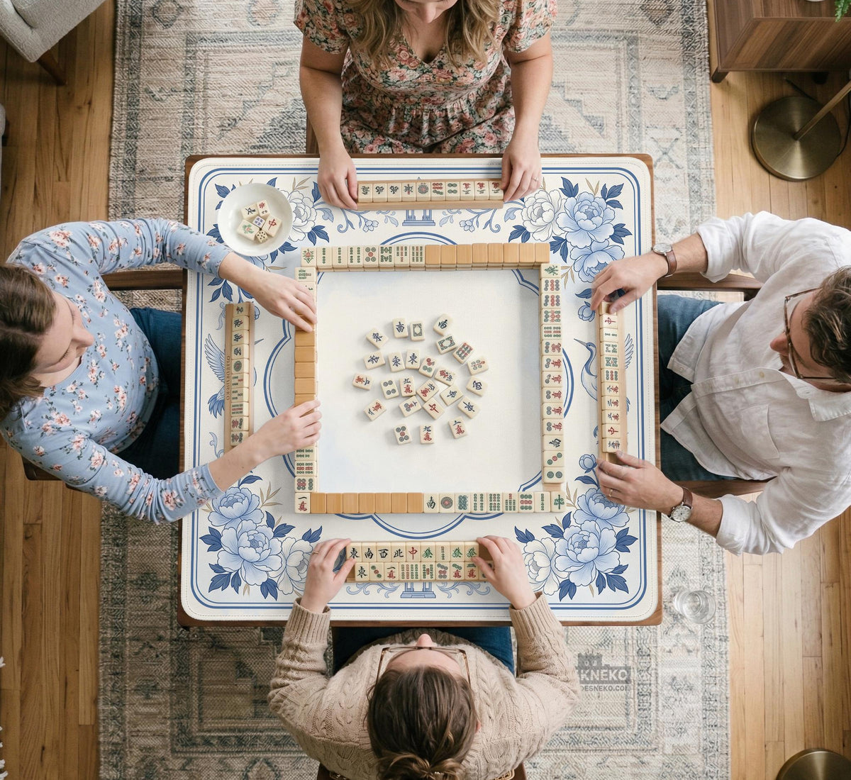 Square mahjong mat with a blue chinoiserie floral pattern on a light background.
