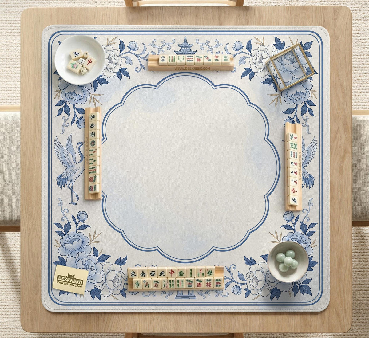 Square mahjong mat with a blue chinoiserie floral pattern on a light background.
