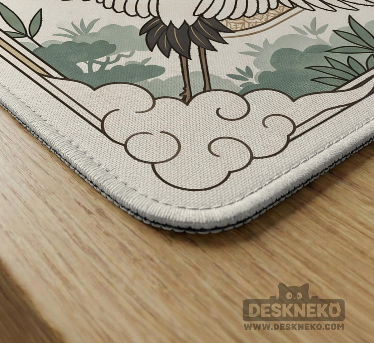 Square mahjong table mat with a cream center and a border design of cranes, bamboo, plum blossoms, and a geometric frame in sage green and warm gold.