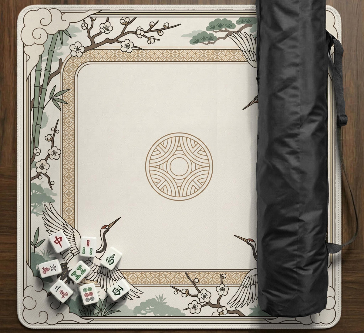 Square mahjong table mat with a cream center and a border design of cranes, bamboo, plum blossoms, and a geometric frame in sage green and warm gold.