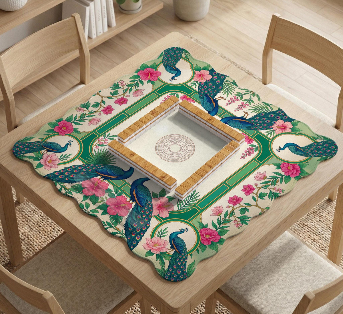 Green mahjong mat with peacocks, hibiscus flowers, tropical leaves, cream center space, and a scalloped floral border.