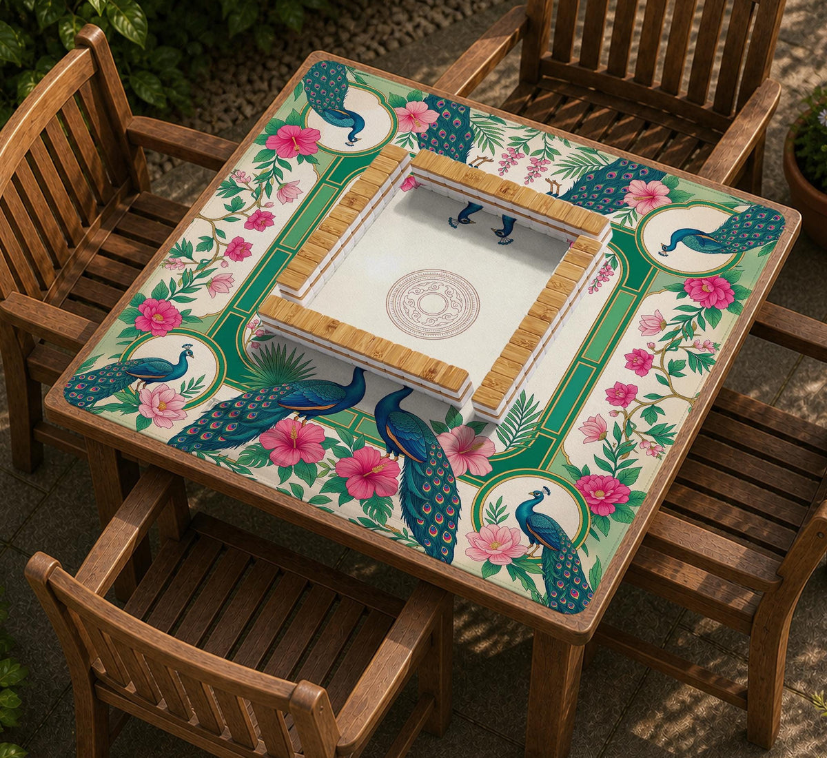 Green mahjong mat with peacocks, hibiscus flowers, tropical leaves, cream center space, and a scalloped floral border.