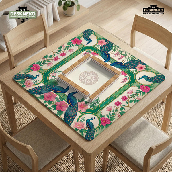 Green mahjong mat with peacocks, hibiscus flowers, tropical leaves, cream center space, and a scalloped floral border.