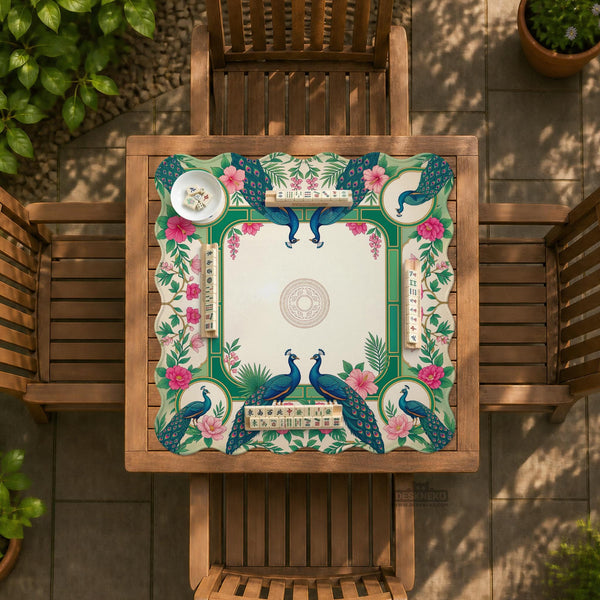 Green mahjong mat with peacocks, hibiscus flowers, tropical leaves, cream center space, and a scalloped floral border.