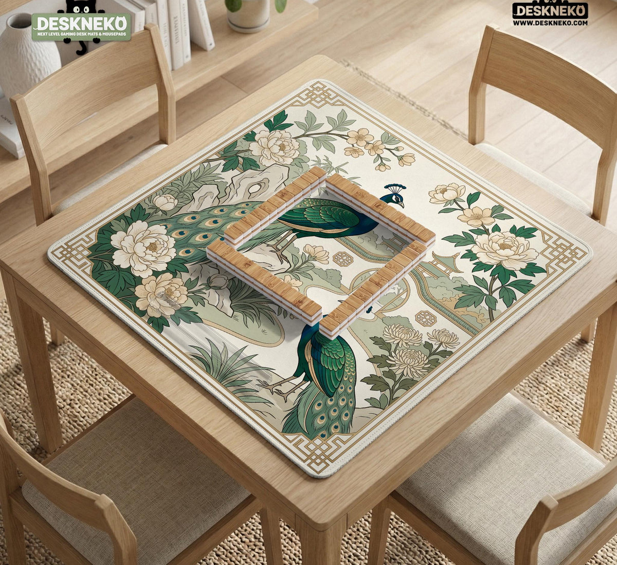 A green mahjong mat with peacock, floral, bamboo, pagoda, and gold border artwork in a scalloped chinoiserie style.