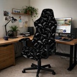 Black chair cover with a bat and star pattern shown on a gaming chair, with multiple cover style options listed for full chair, back and seat, seat only, and armrests.