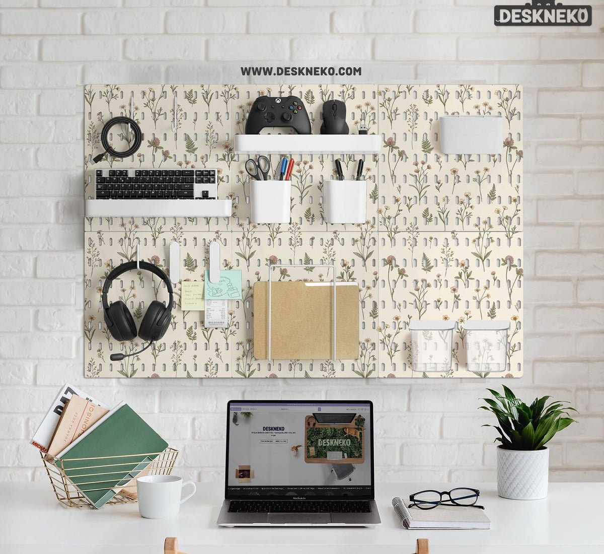 Cream pegboard wall organizer with small floral print, sage green stems, black slot layout, shelves, hooks, clips, and containers.