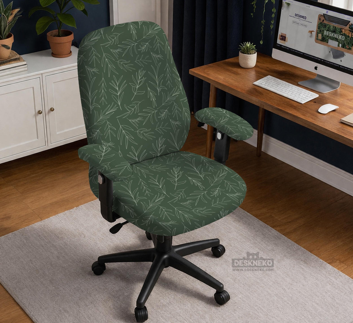 A forest green chair cover with a sage green leaf print shown on a high-back office or gaming chair.