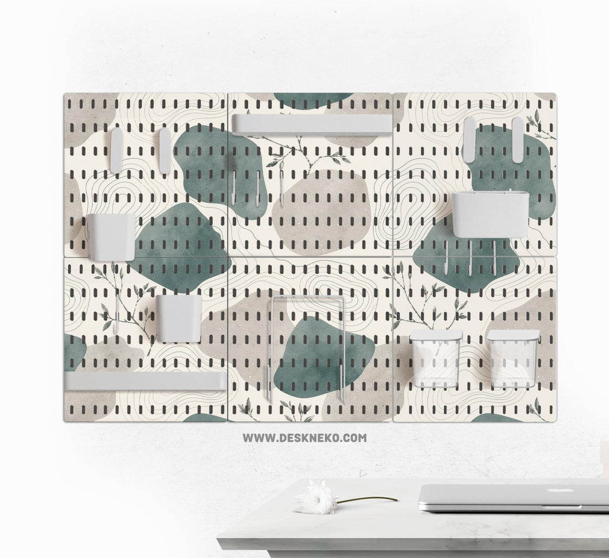 Four pegboard panels in sage green with cream, grey, teal, and leafy botanical artwork arranged in a square layout.
