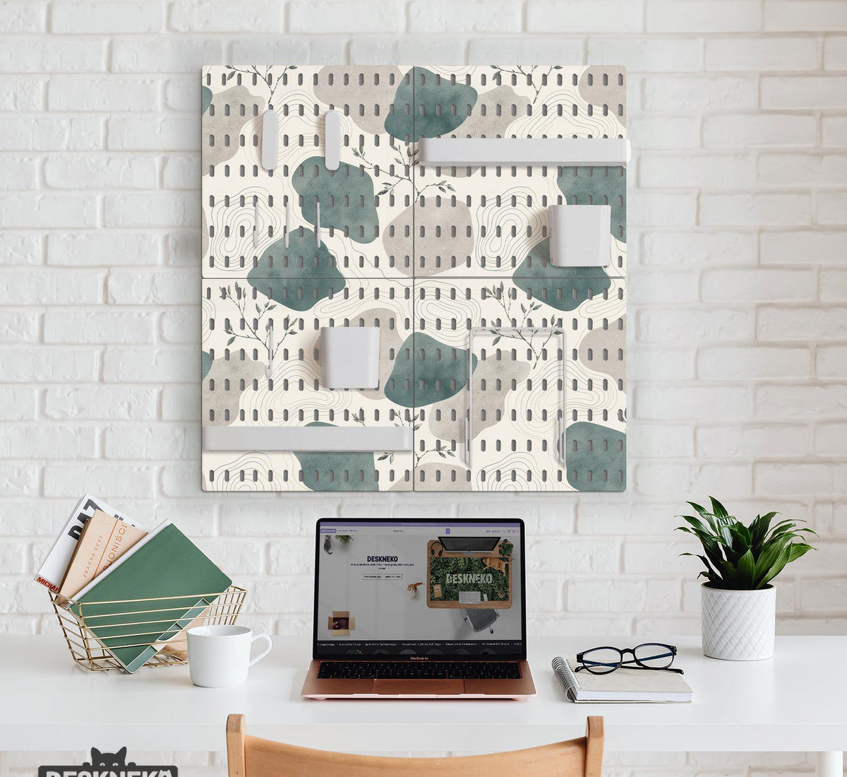 Four pegboard panels in sage green with cream, grey, teal, and leafy botanical artwork arranged in a square layout.