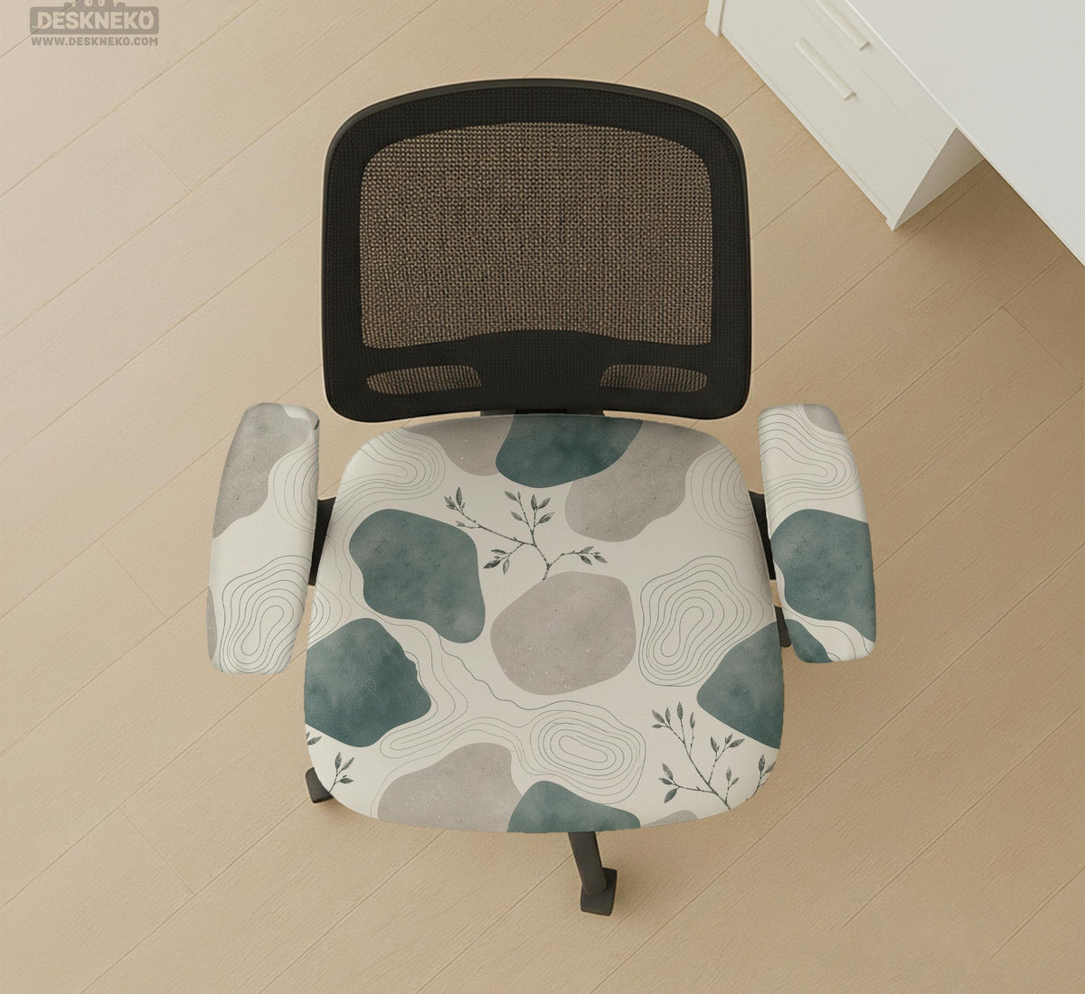 Chair cover with a cream background, muted sage abstract shapes, grey organic forms, and small botanical accents.