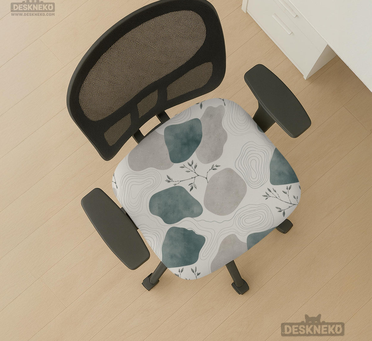 Chair cover with a cream background, muted sage abstract shapes, grey organic forms, and small botanical accents.
