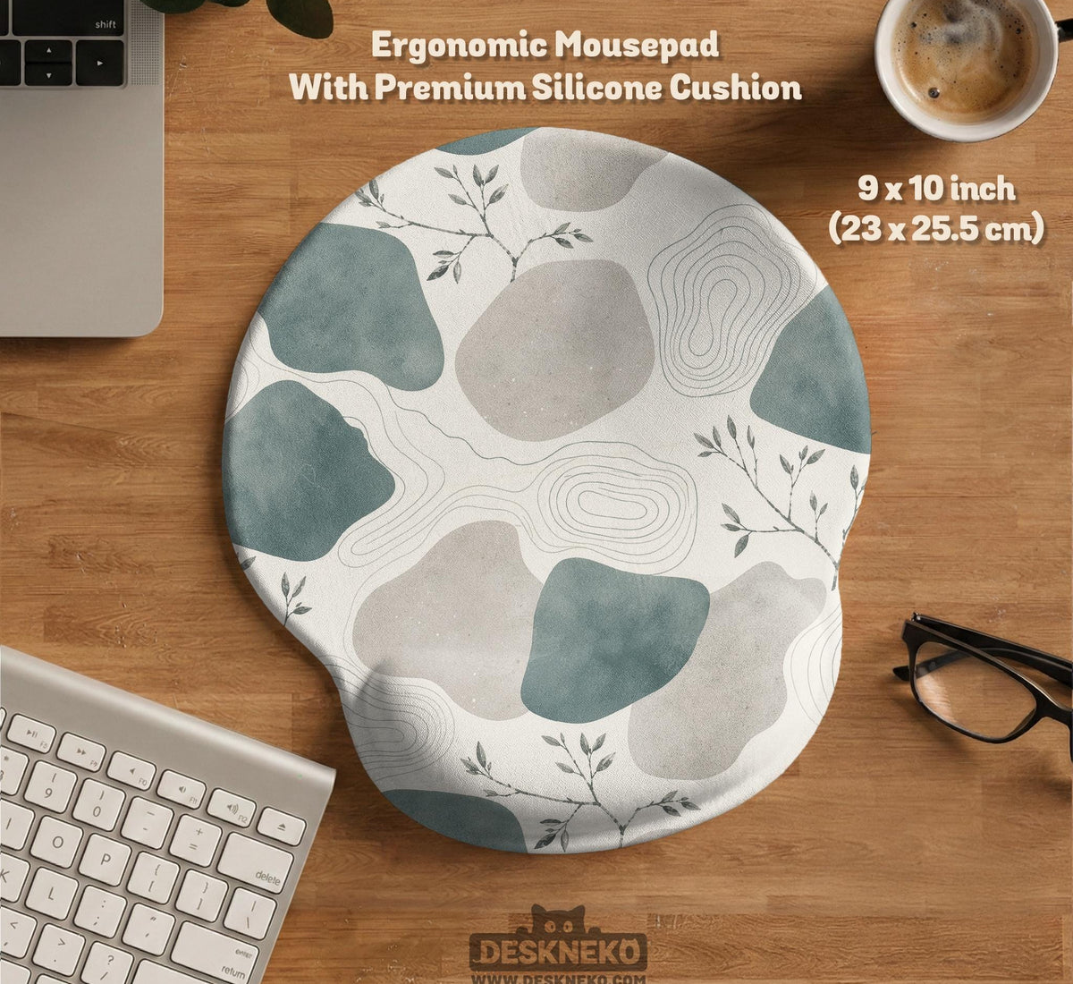 Sage green ergonomic mousepad and keyboard wrist rest with abstract shapes, soft gray details, cream space, topographic contour lines, and leafy branch accents.