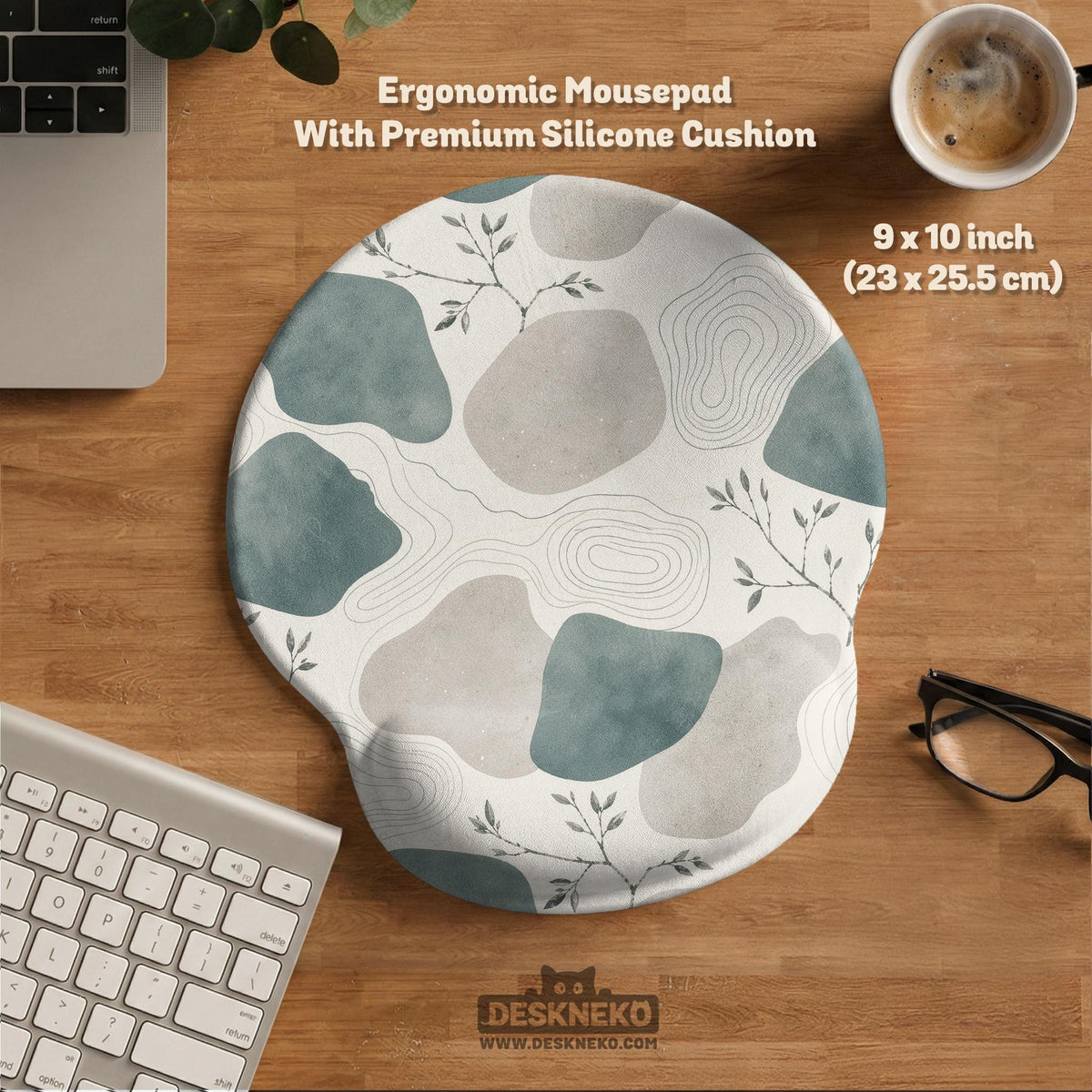Sage green ergonomic mousepad and keyboard wrist rest with abstract shapes, soft gray details, cream space, topographic contour lines, and leafy branch accents.