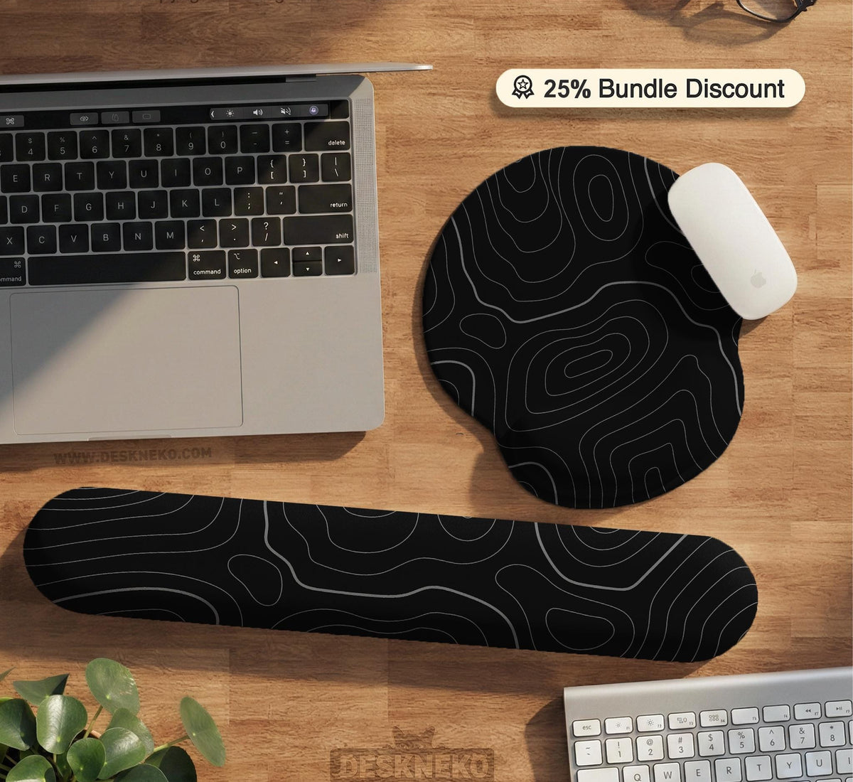 Black desk mat with a thin gray topographic contour line pattern.