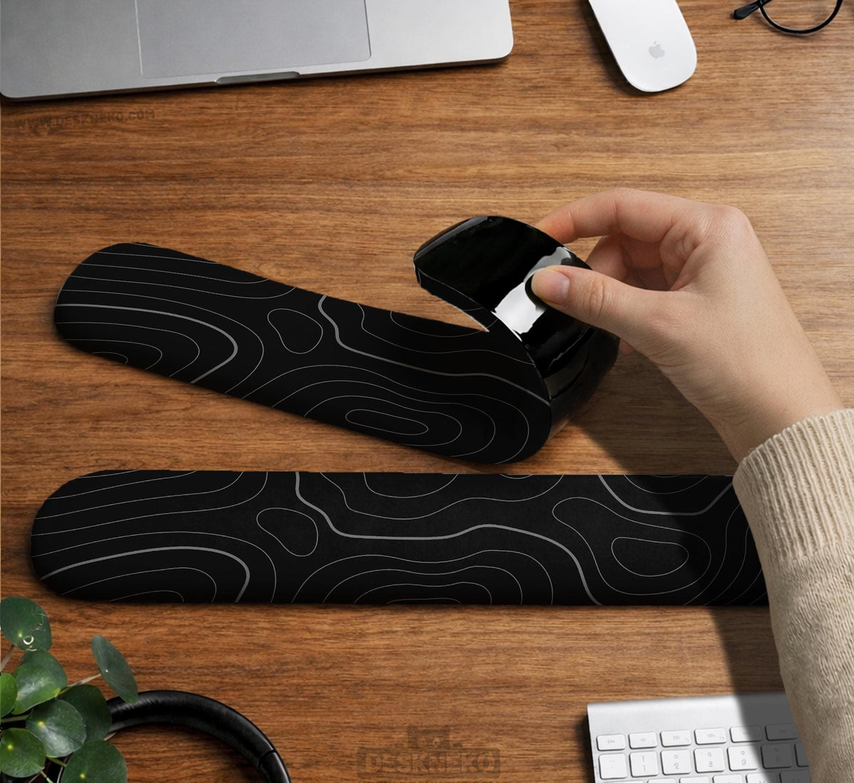 Black mousepad with a gray topographic contour line pattern shown with matching keyboard wrist rest options.