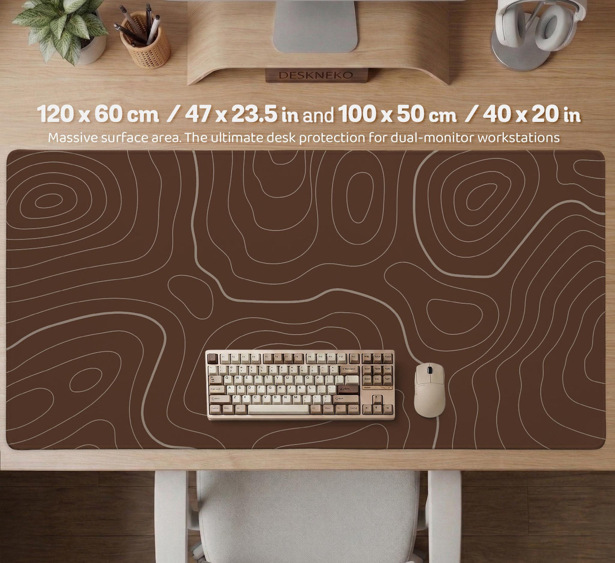 Brown desk mat with a repeating topographic contour line pattern in a neutral earth tone design.
