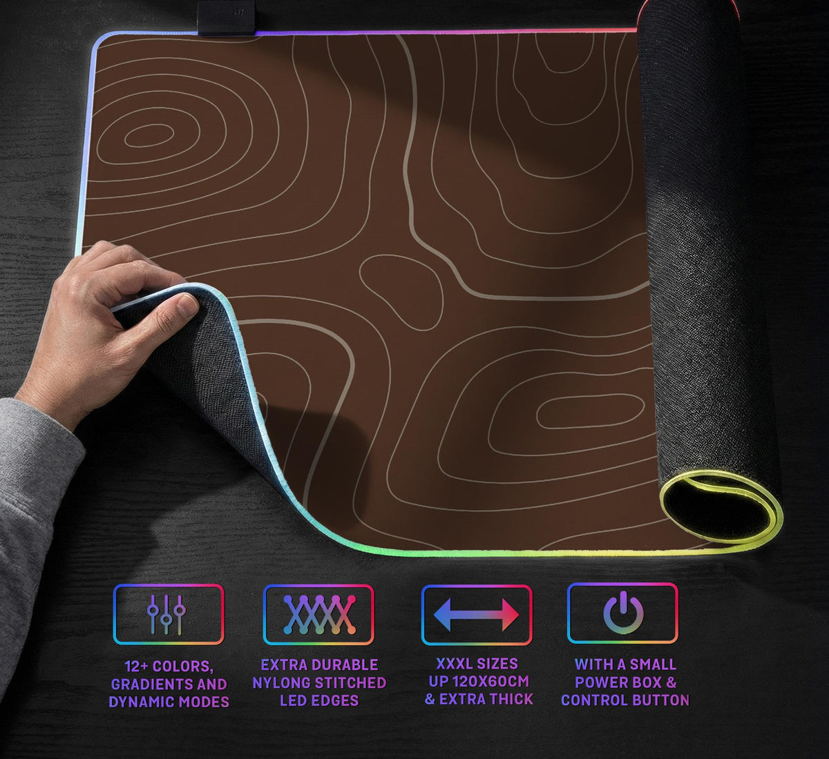 Brown desk mat with a repeating topographic contour line pattern in a neutral earth tone design.