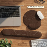 Brown mousepad and keyboard wrist rest with a topographic contour-line pattern.
