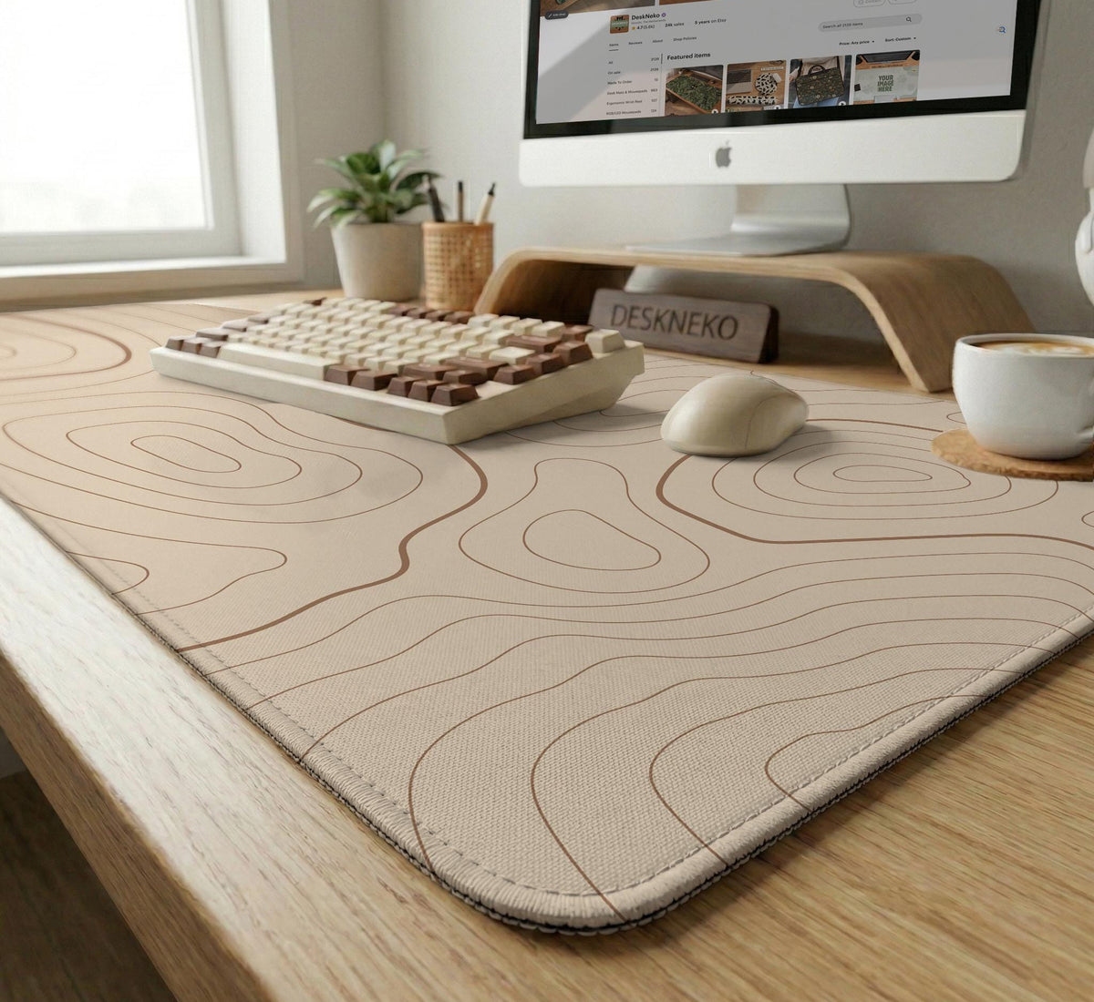 A beige mousepad with a topographic line pattern in a repeating design.