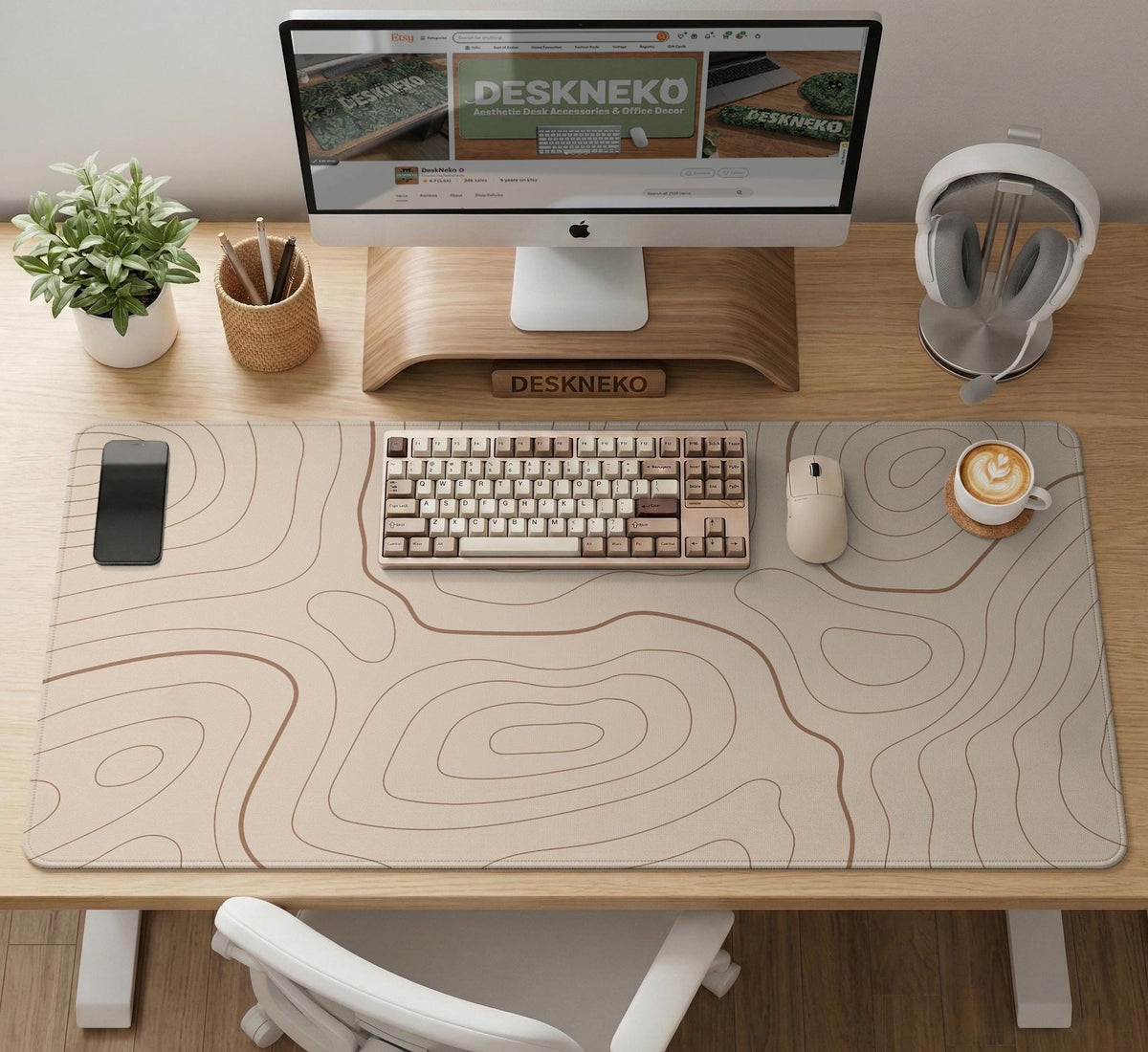 A beige mousepad with a topographic line pattern in a repeating design.