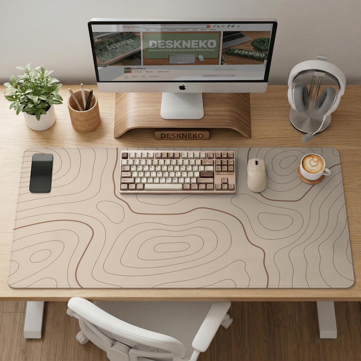 A beige mousepad with a topographic line pattern in a repeating design.