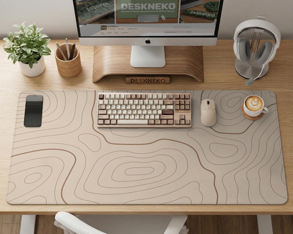 A beige mousepad with a topographic line pattern in a repeating design.