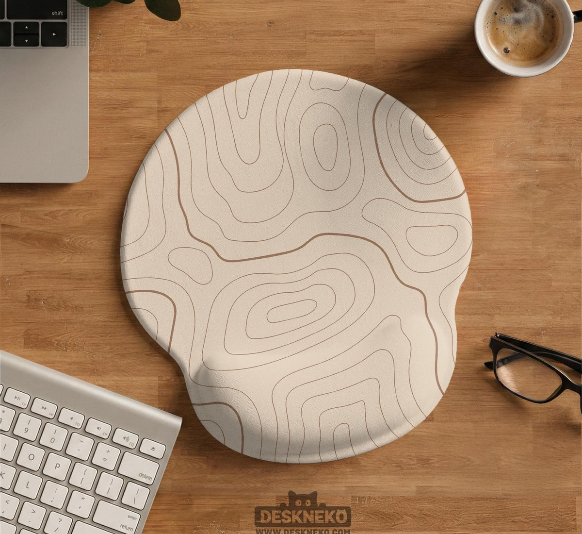 Beige mousepad and keyboard wrist rest with a topographic line pattern shown in a neutral desk setup.