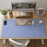 A periwinkle deskmat with thin blue contour lines printed across the surface.