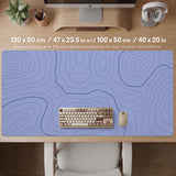 A periwinkle deskmat with thin blue contour lines printed across the surface.