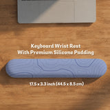 A periwinkle deskmat with thin blue contour lines printed across the surface.