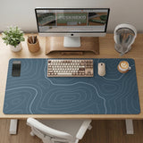 Blue mousepad with a topographic line pattern on a slate background.