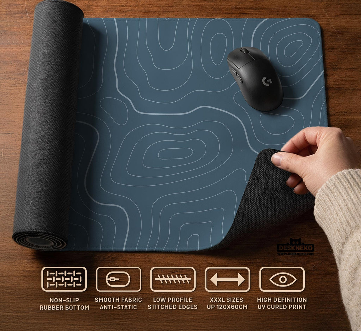 A slate blue desk mat with thin contour line map art on a light background.