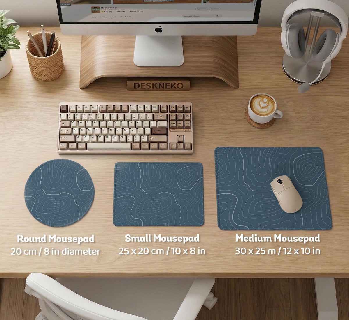 A slate blue desk mat with thin contour line map art on a light background.