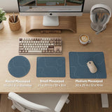 A slate blue desk mat with thin contour line map art on a light background.