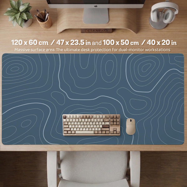 Blue mousepad with a topographic line pattern on a slate background.