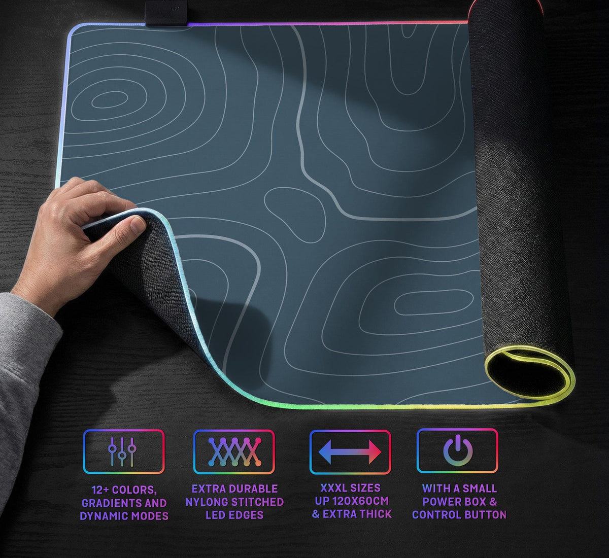A slate blue desk mat with thin contour line map art on a light background.