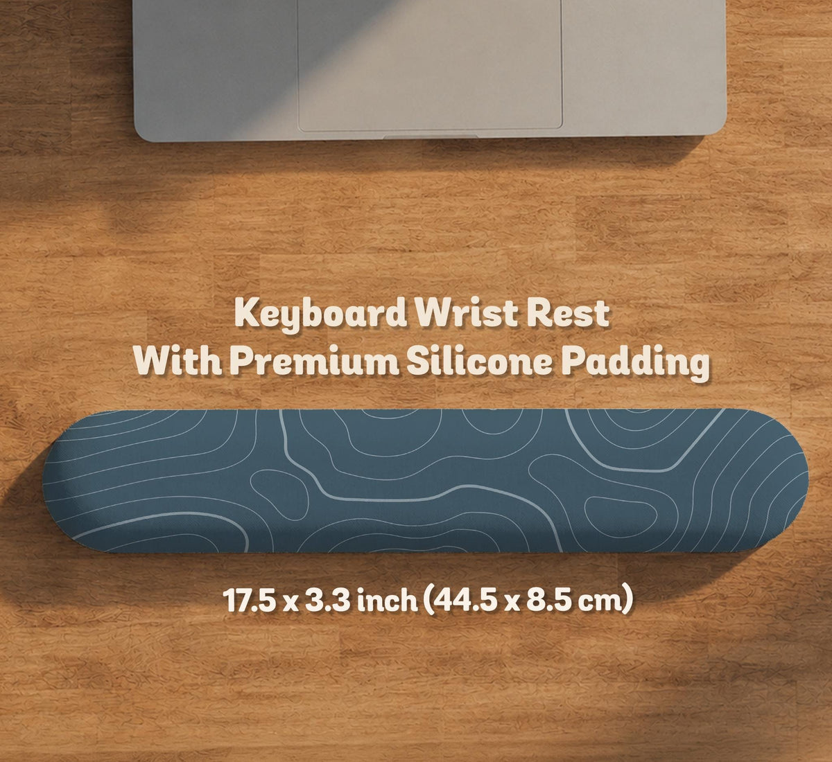A slate blue desk mat with thin contour line map art on a light background.