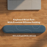 Blue mousepad with a topographic line pattern on a slate background.