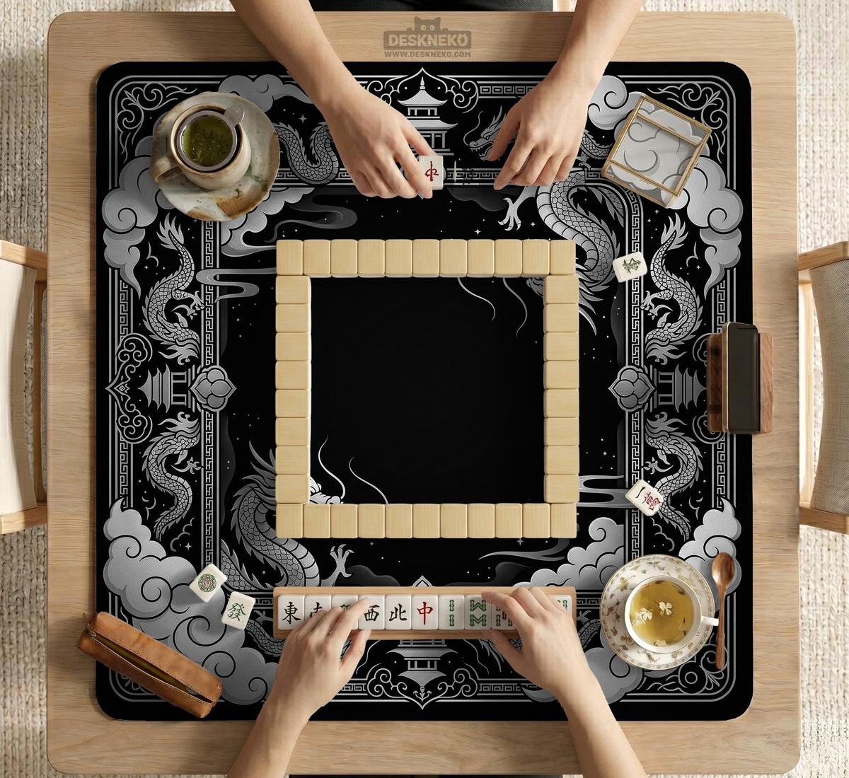 Square mahjong table mat with a black and silver dragon border, cloud details, and a scalloped edge.