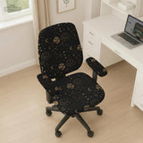 Black chair cover with a dark galaxy pattern, muted gold stars and celestial artwork on a chair.