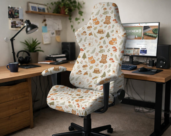 A gaming chair cover with a woodland animal print featuring foxes, rabbits, bears, mushrooms, and leaves in green, brown, and beige tones.