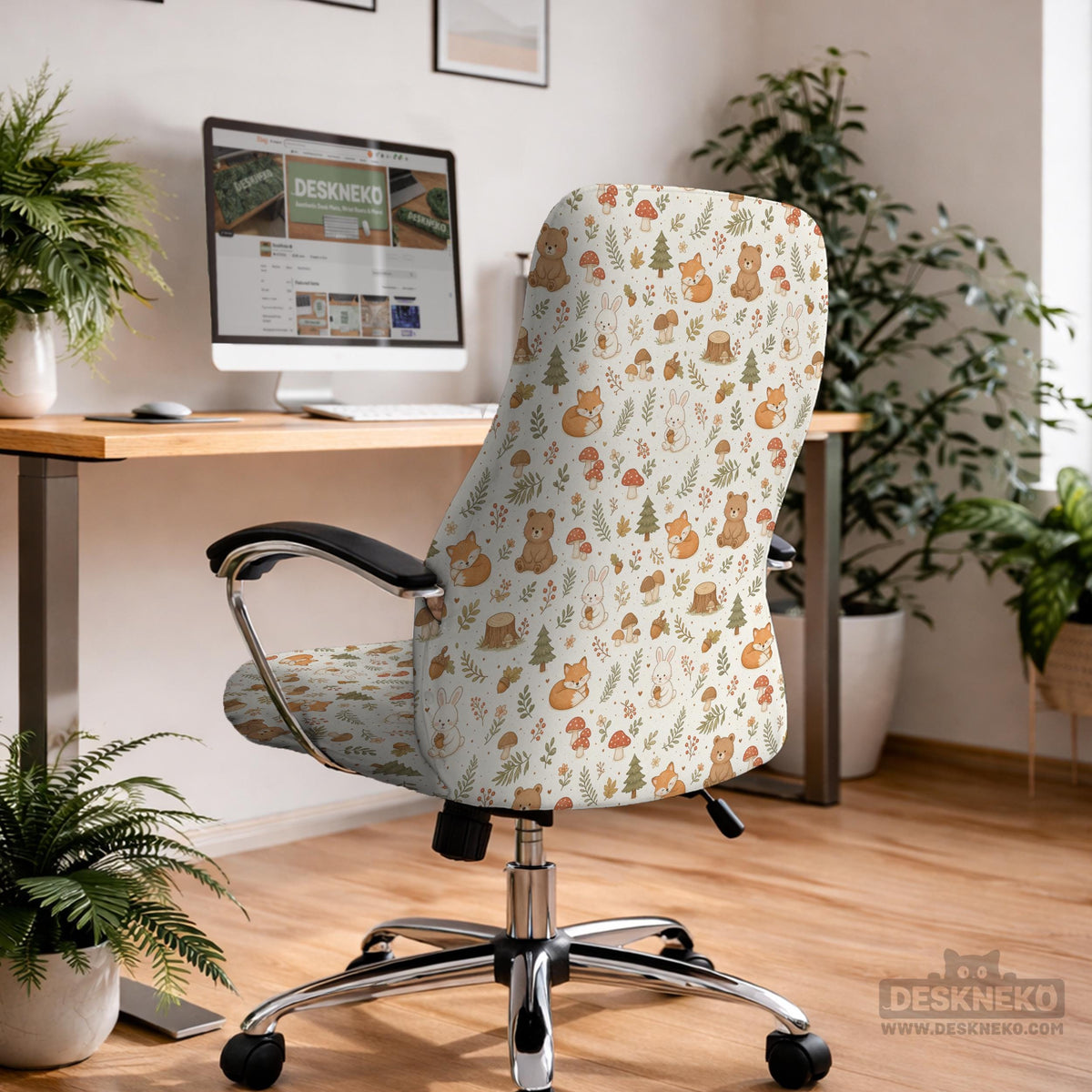 A gaming chair cover with a woodland animal print featuring foxes, rabbits, bears, mushrooms, and leaves in green, brown, and beige tones.